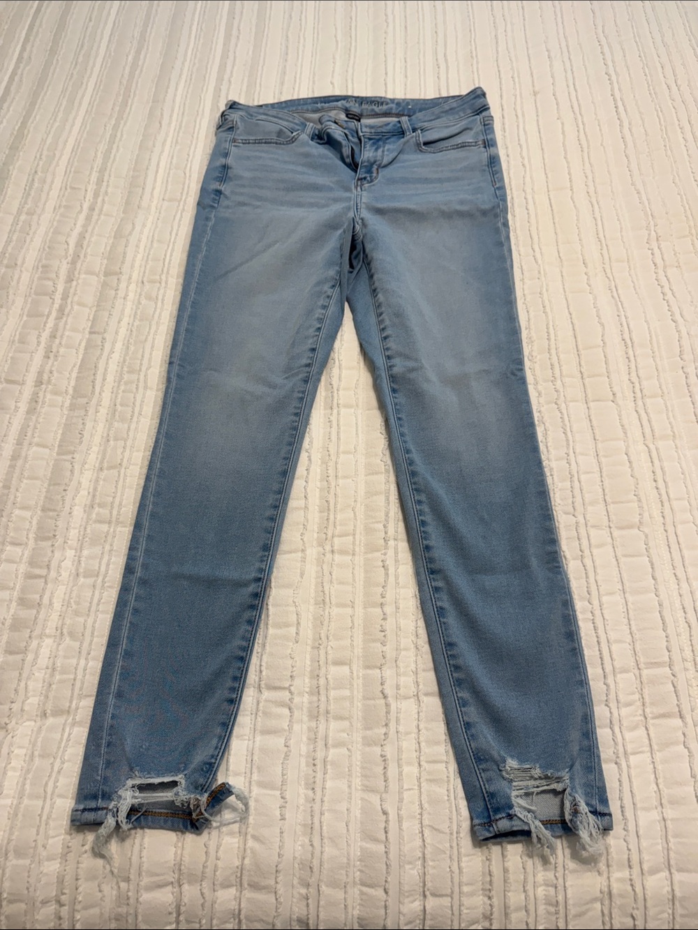 American Eagle Outfitters Light Blue Skinny Jeans with Distressed Ankles